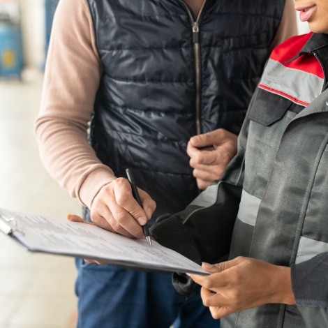 hand-of-male-client-of-automobile-repair-service